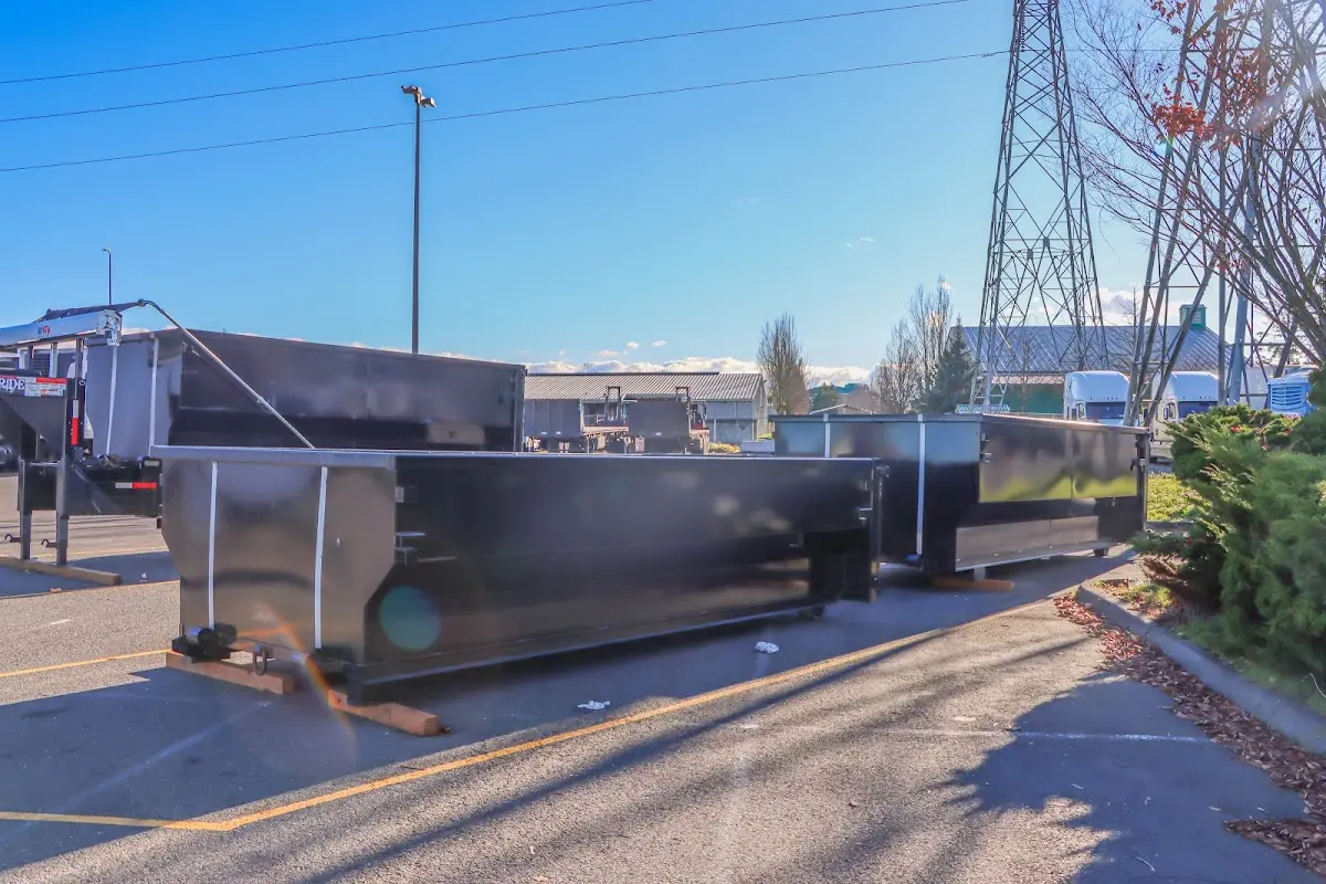 Roll-off dumpster ready for waste disposal at job site for 2 Yard Dumpster Rental in Lansing